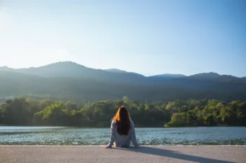 Woman relieving depression symptoms by being outdoors