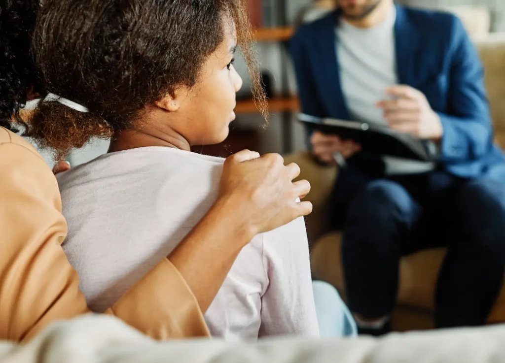 A parent and their child at a professional appointment with Strong Mind Psychiatry