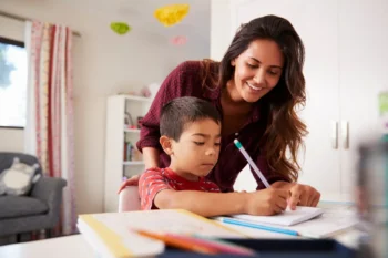 Parent helping child with ADHD with his homework