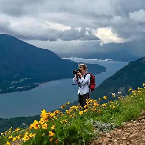 Photographer taking pictures of the Columbia River in the Gorge outside of Vancouver, WA