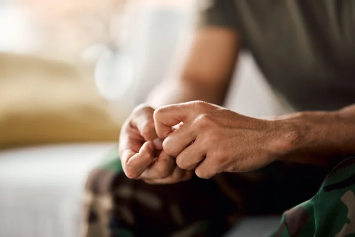 A close up of a persons fidgeting with their hands